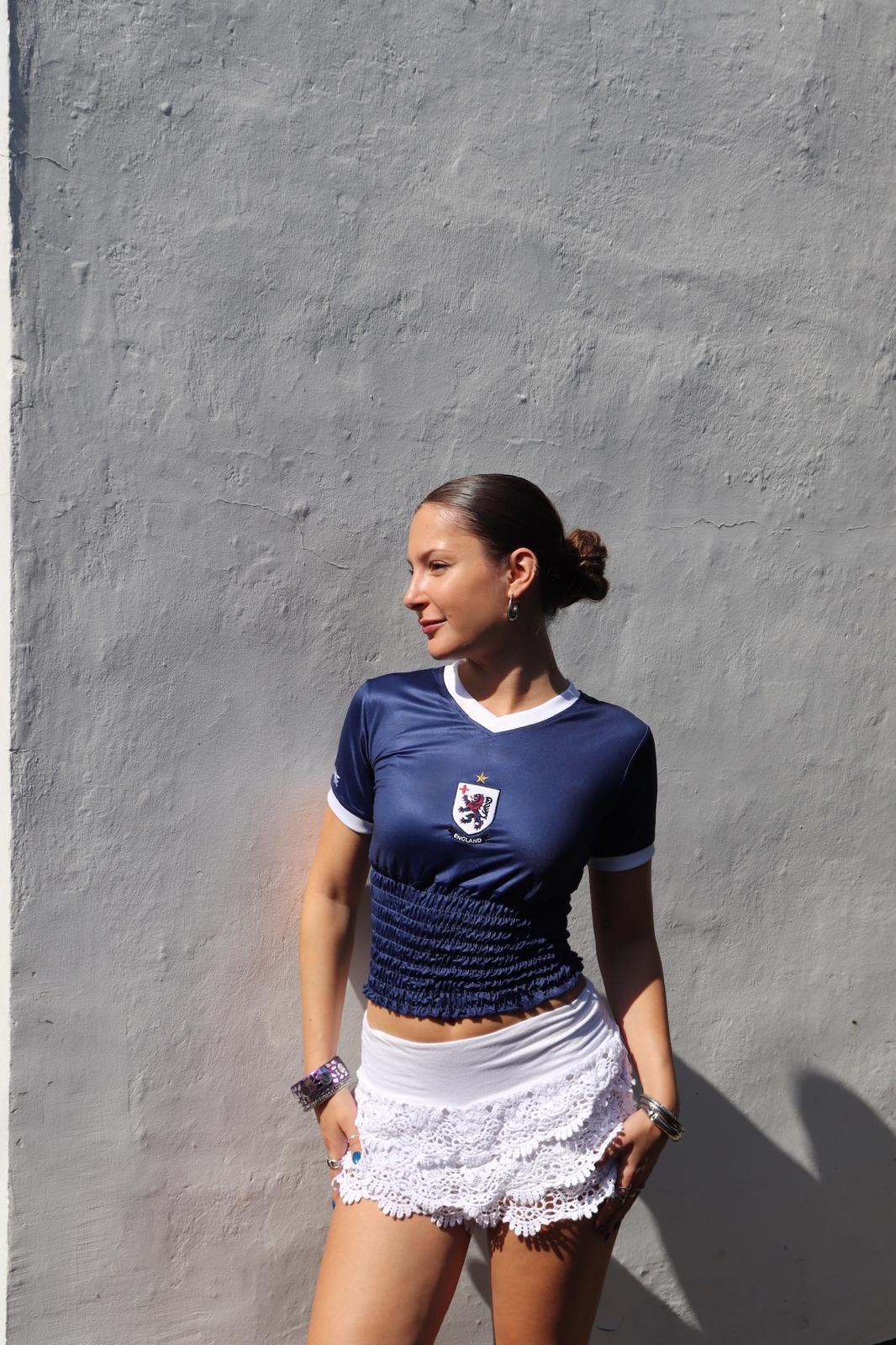 Smocked at the waist, fluted at the hem